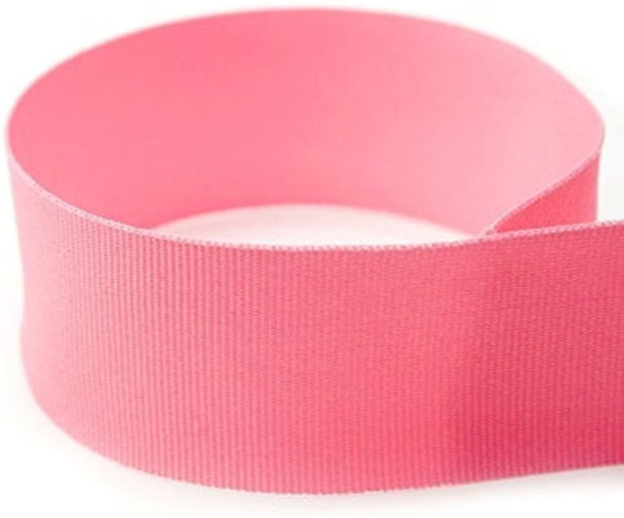 Pink solid grosgrain ribbon shown in a loose loop.