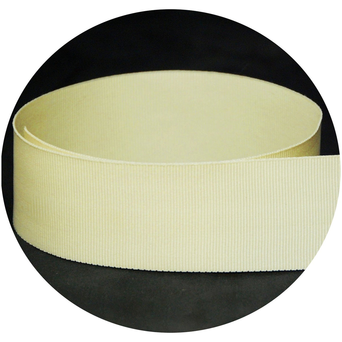 Cream solid grosgrain ribbon shown in a loose loop.